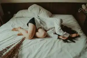 woman sleeping without covers